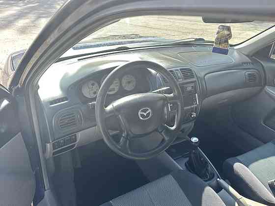 Mazda 323 2002 год Парканы Парканы